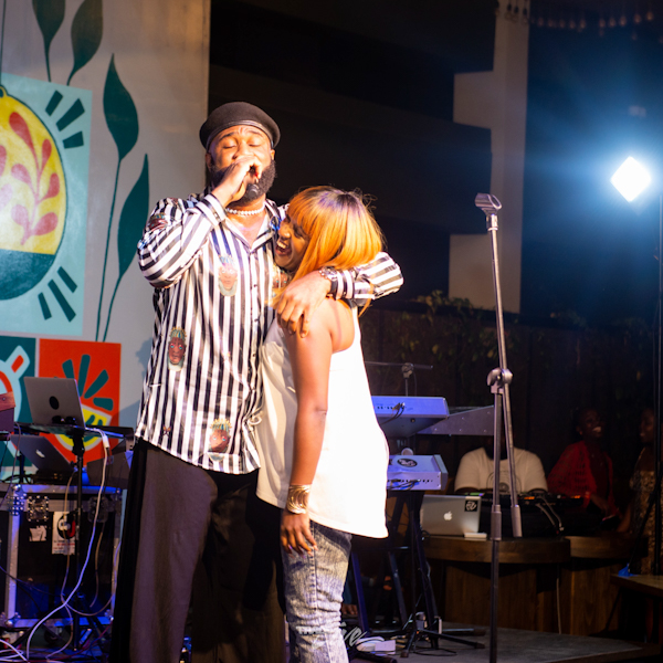 Janet Mwendwa hugs Priaz on stage during the Trace Live concert on 27th May 2022