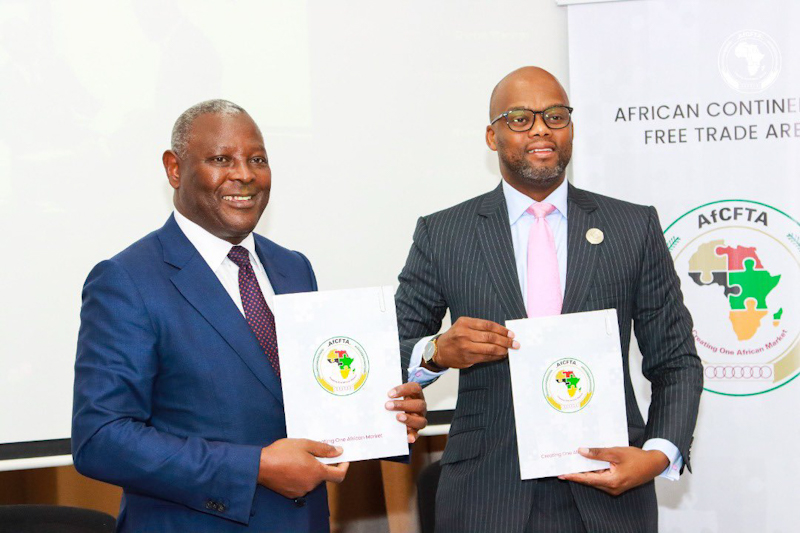 Dr. James Mwangi, Equity Group Managing Director and CEO (left) and H.E Wamkele Mene, AfCFTA Secretary General (right) display signed partnership agreement during the official launch of the partnership at the margins of the 41st Ordinary Session of the Executive Council of the African Union that will deepen the economic integration of the African continent.