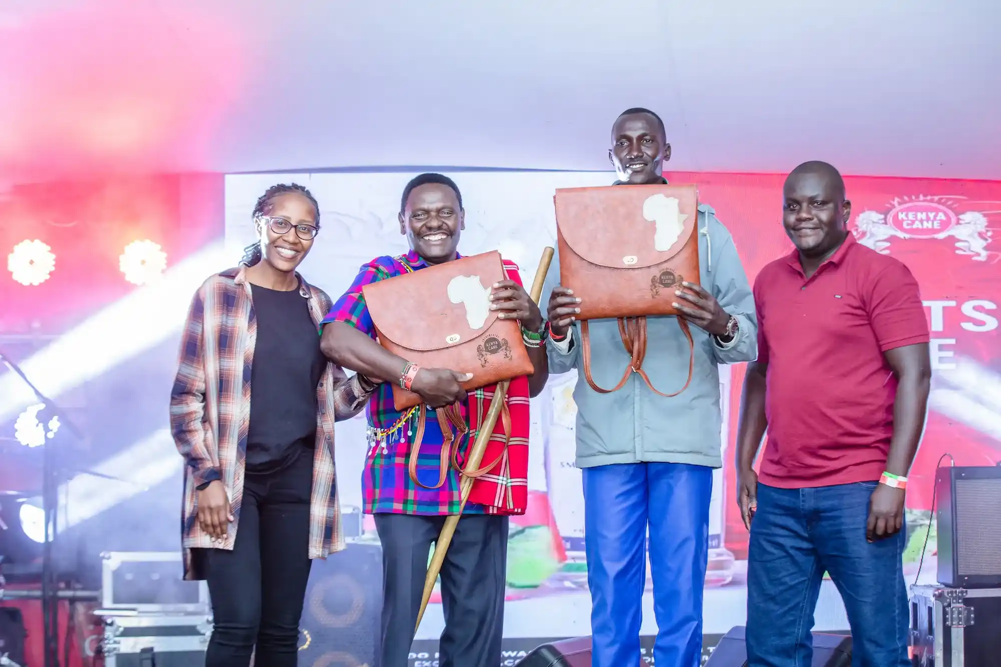 Narok Greats winners Paul Ole Sopia and Joel Koirag pose for a photo with Kenya Cane Brand Manager Davis Changalwa and Shopper Manager Mercy Gitari at the Kenya Cane Greats Fest held at the Boma Resort and Lounge, Narok on Saturday 14 th October.