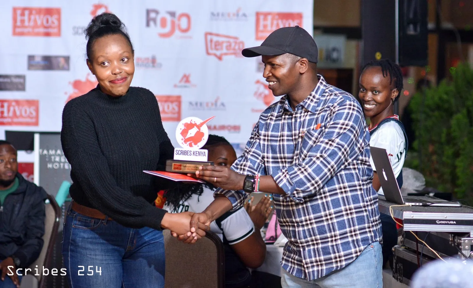 Anne Macharia receiving her award during the 5th annual Scribes End of Year Party