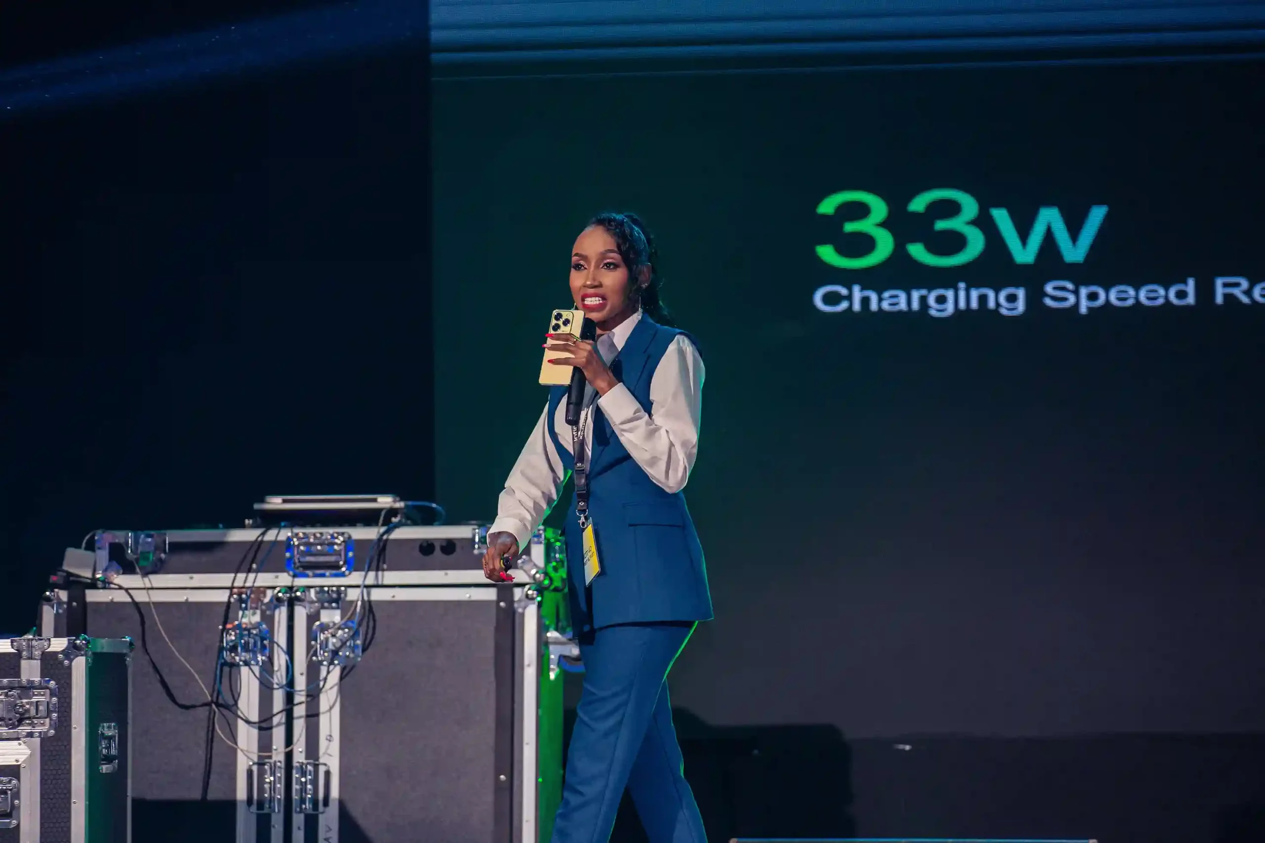 Cynthia Njiru Infinix Kenya PR speaking during the launch of the HOT 40 series, featuring the HOT 40 Pro, HOT 40, and HOT 40i models providing gamers of all budgets an action-packed smartphone to level up their mobile entertainment experience.