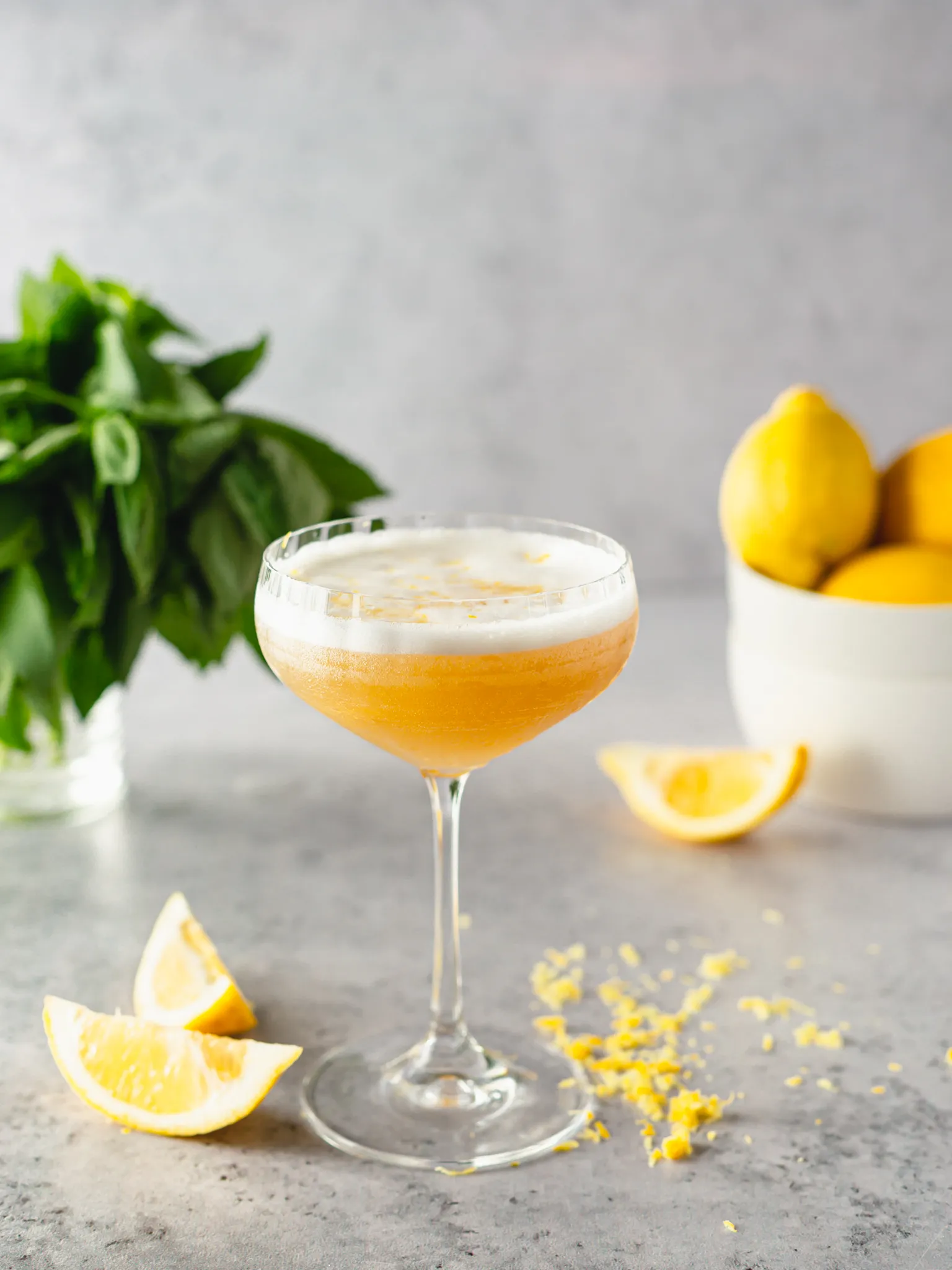 Lemon fruit cocktail on a table. Garnished with lime.
