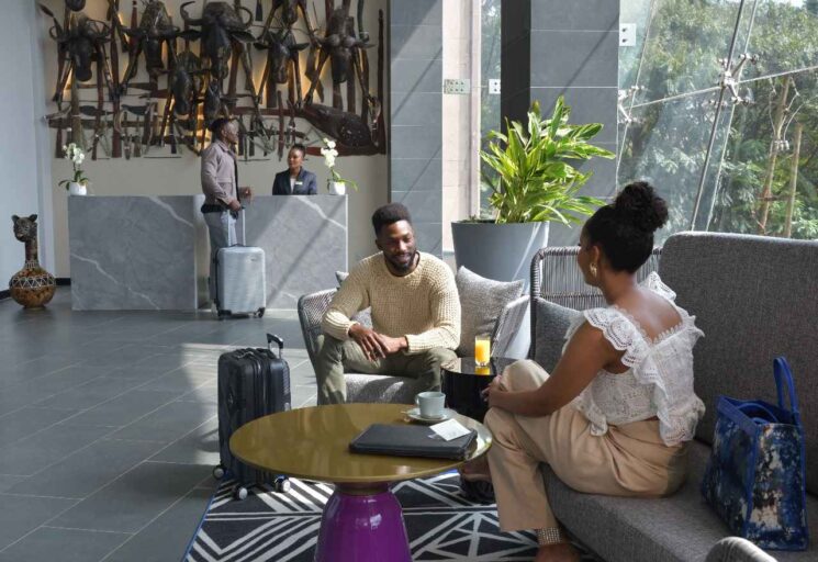 Guests enjoying sunset views from Novotel’s rooftop pool