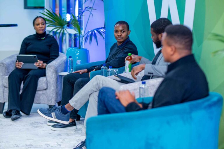 Watu leadership team in a panel discussion on inclusive mobility and fintech innovation, featuring Erick Massawe, Chris Rumenda, Eric Tsui, and Proud Dzambukira.