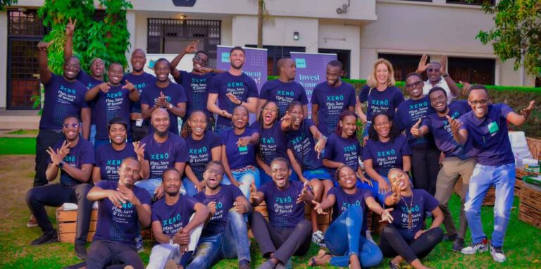 XENO Investment team posing outdoors in branded T-shirts