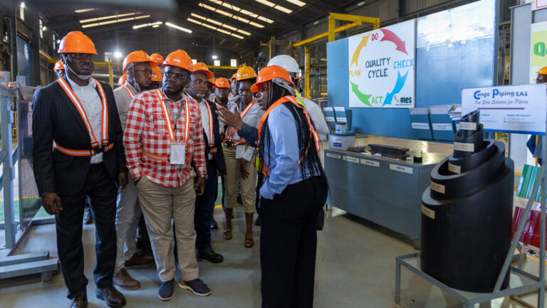 Delegates observe recycling and pipe production at Congo Piping, part of MES Holdings in Lubumbashi during the DRC trade mission.