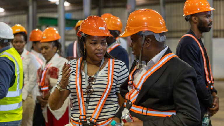 Delegates interact at Mamba Roofing Sheets Ltd, part of MES Holdings in Lubumbashi during the DRC trade mission.