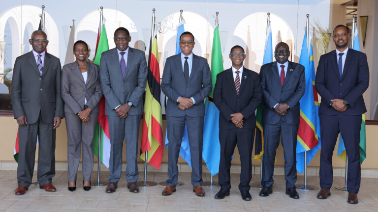 Central bank governors and deputy governors from EAC Partner States standing together in Kampala for the 29th Monetary Affairs Committee meeting