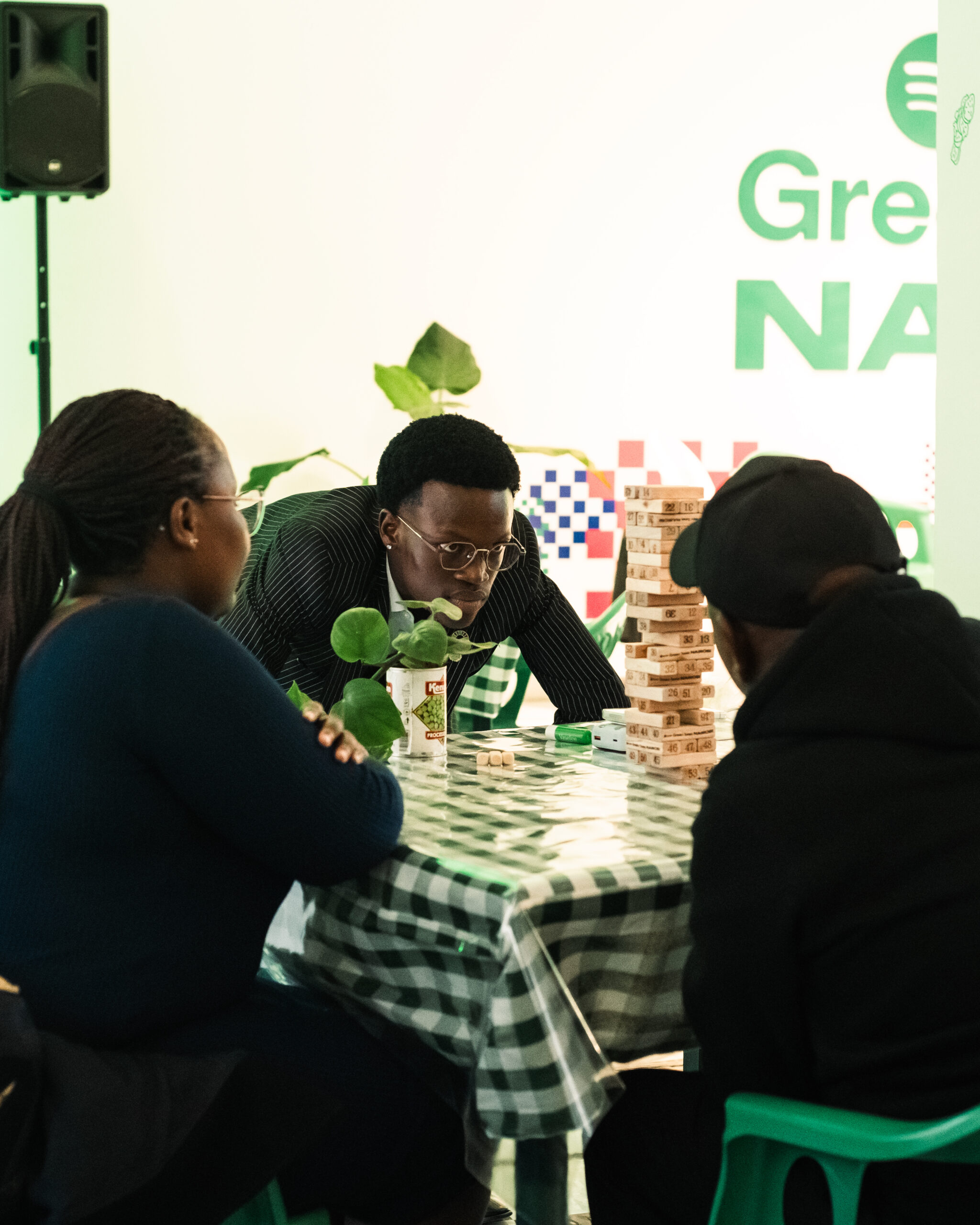 Attendees playing Jenga at the Greasy Tunes Café and Hotspot in Nairobi