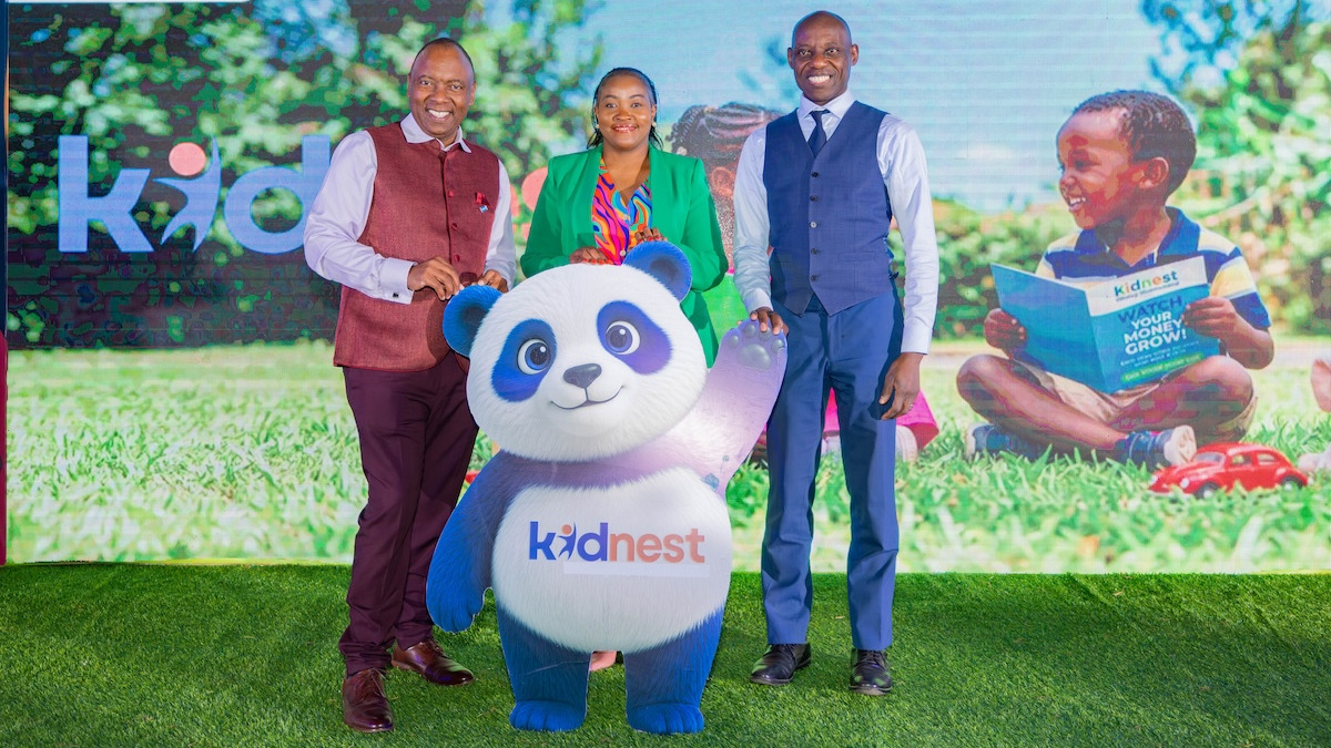 Britam executives Tom Gitogo, Concepta Ayuma and Barack Obatsa pose with the Kidnest mascot at the KidNest launch event