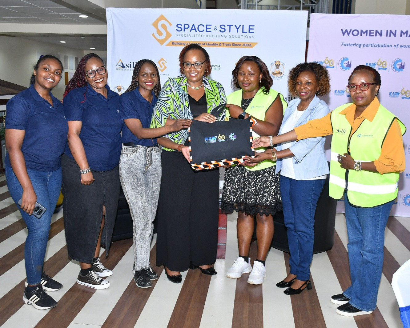 Ms. Winnie Ngumi and the Space and Style team receiving a token of appreciation from the Women in Manufacturing team during the 6th episode of the WIM Fireside Chat.