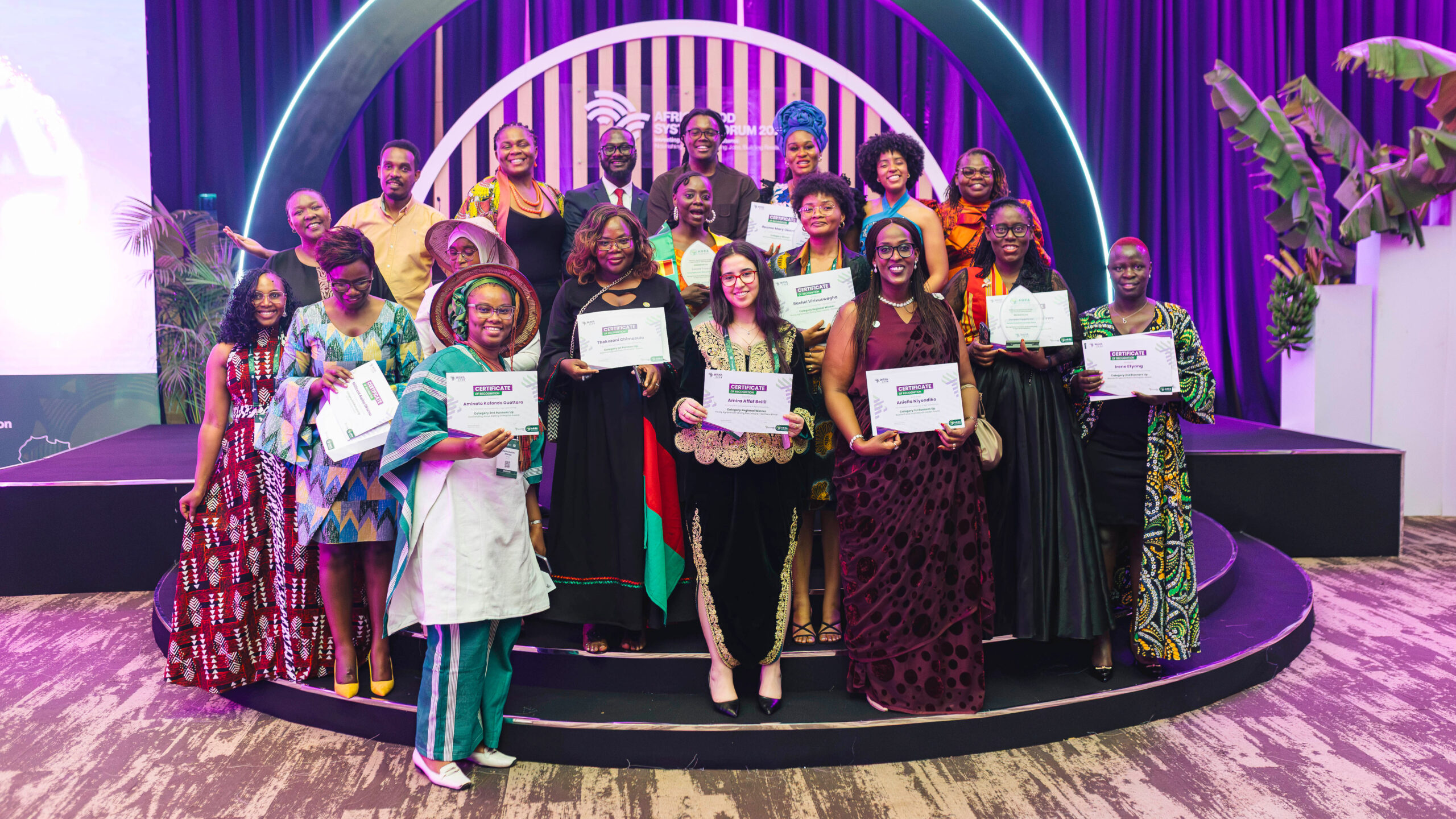 Runners-up and regional winners of the WAYA 2026 awards pose with their certificates on stage at the Africa Food Systems Forum in Kigali.
