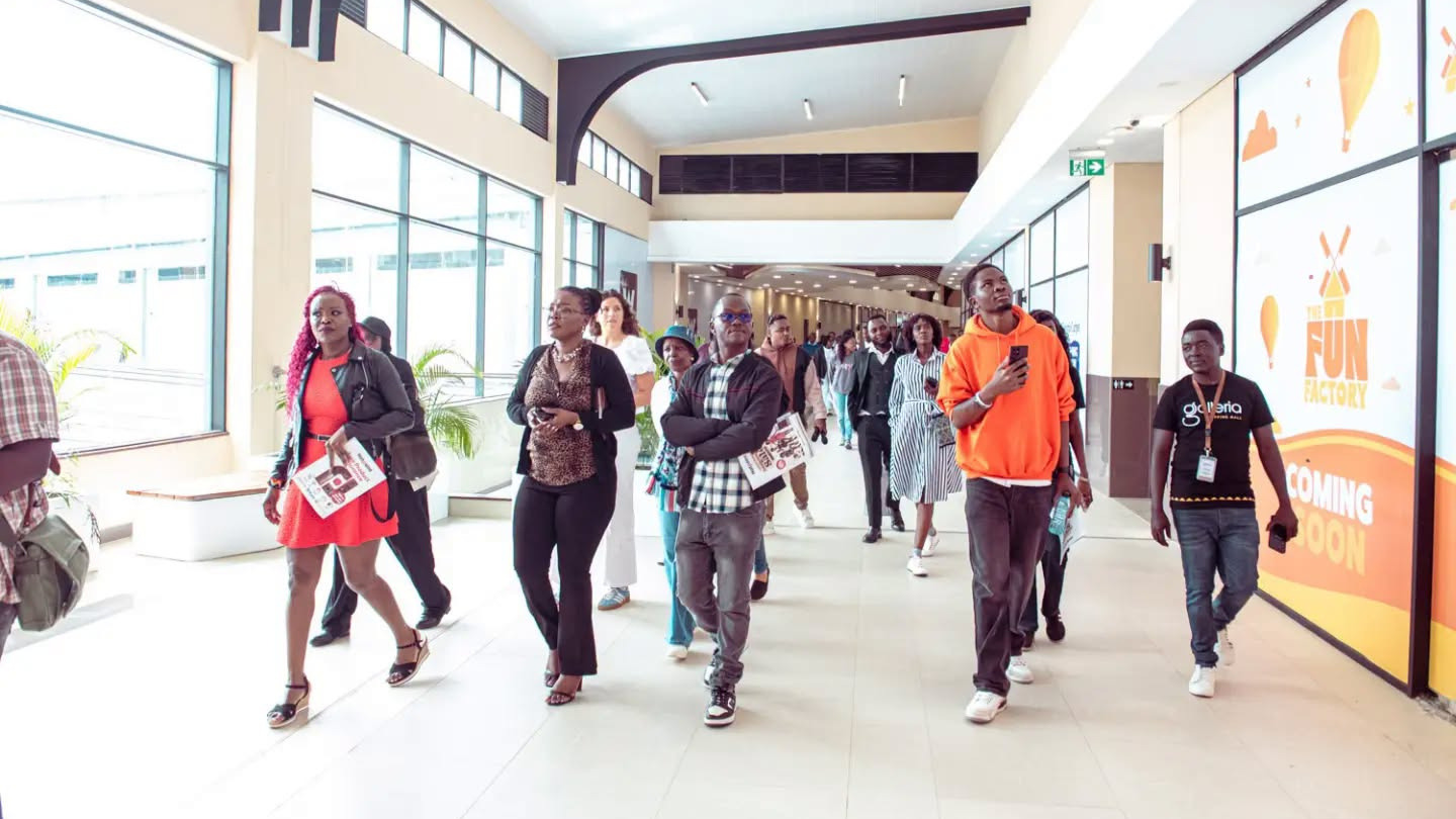Customers walking through the brightly lit corridor during the soft launch of the new Galleria Experience in July 2026.