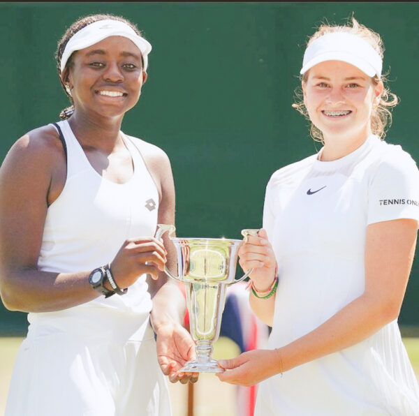 Angella Okutoyi and her Dutch partner Marie Nijkamp after winning the 2022 Wimbledon junior doubles