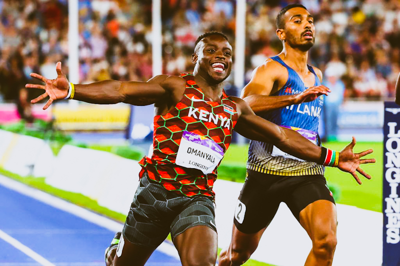 Kenya's Ferdinand Omanyala celebrates winning and taking the gold medal during the men's 100m final athletics event at the Alexander Stadium, in Birmingham