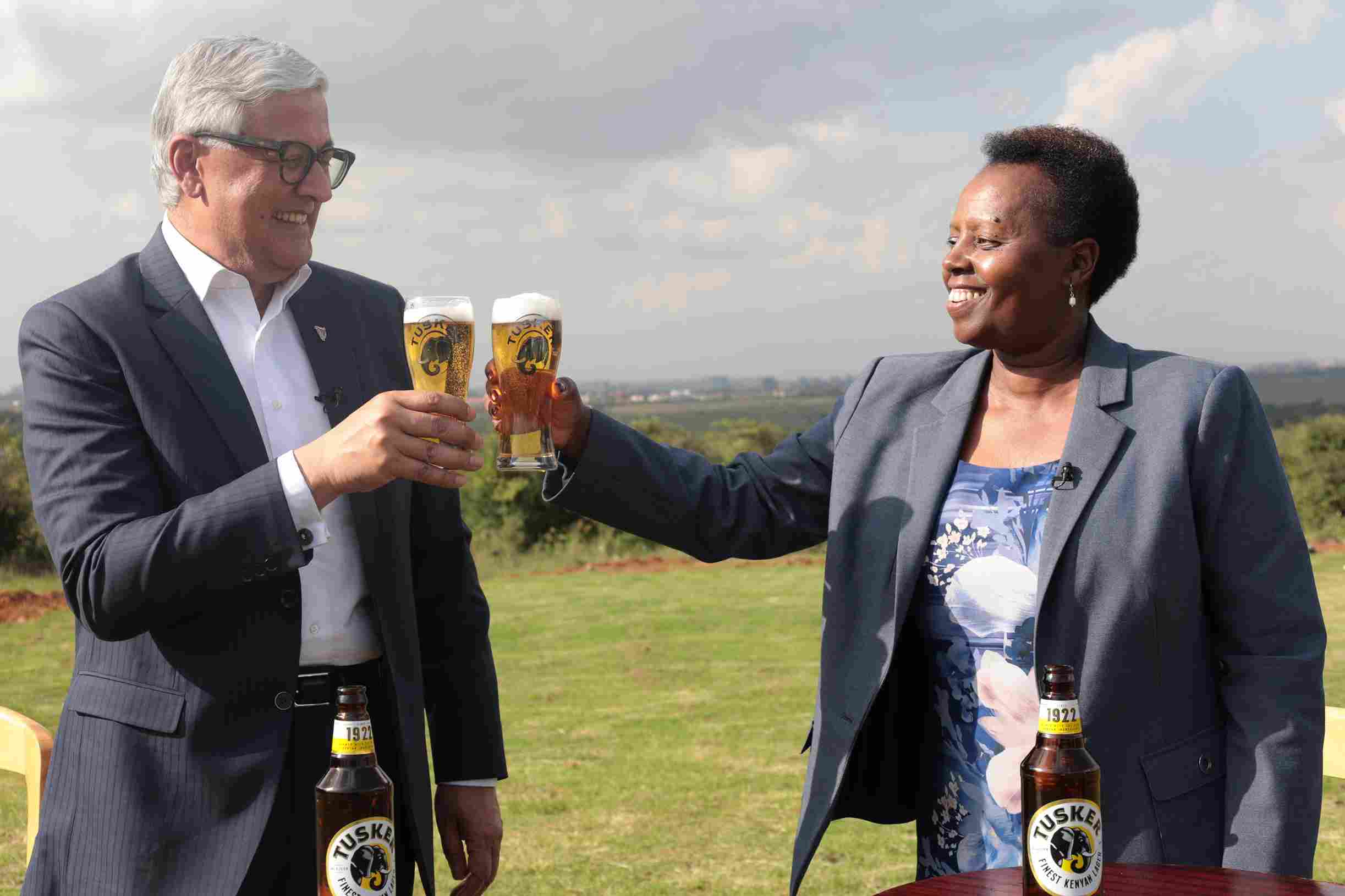 At the centennial celebrations held May 19, 2022, at Nairobi National Park, CEO Ivan Menezes shares a Tusker Lager with EABL MD Jane Karuku.