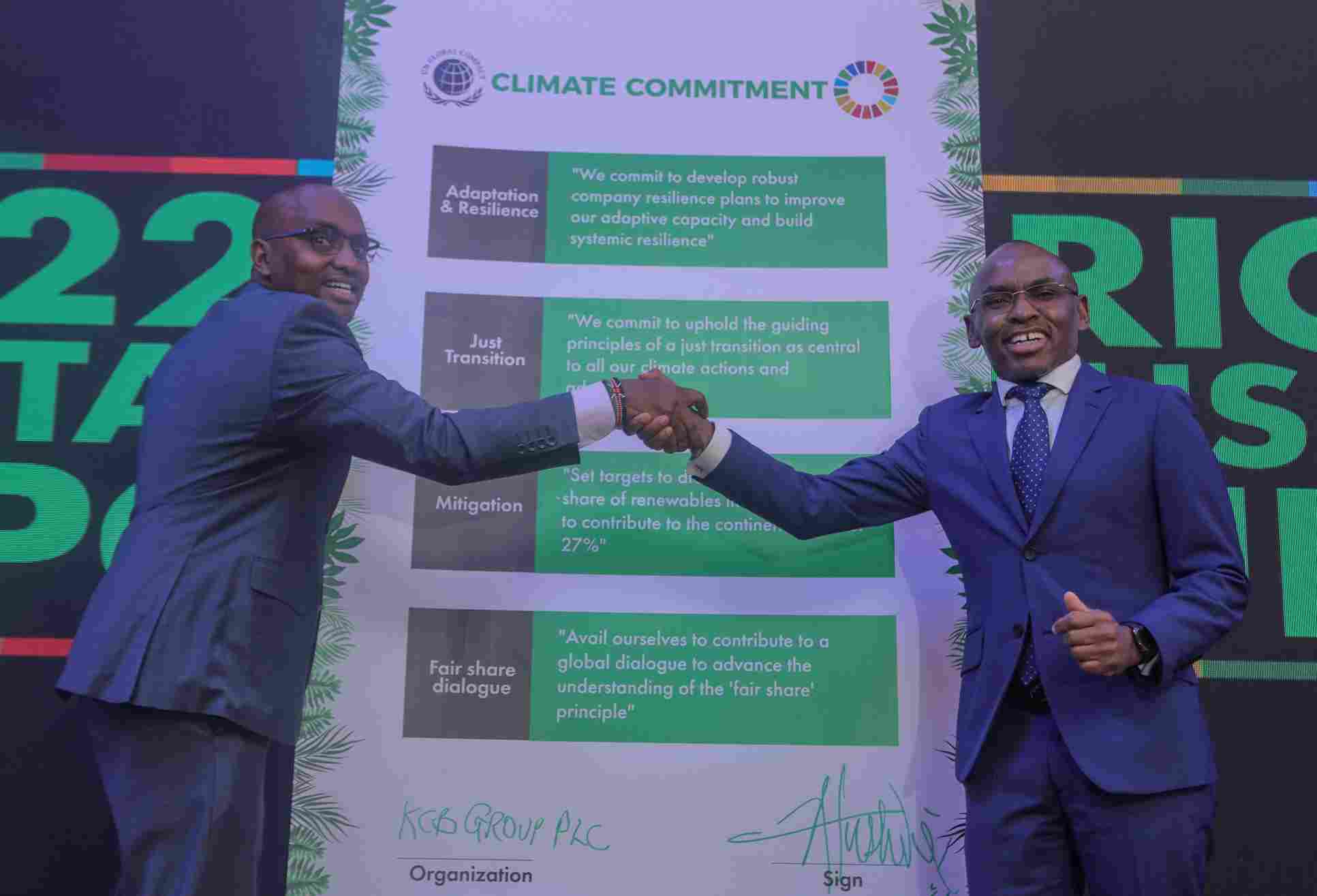 KCB Group CEO Paul Russo left with Safaricom PLC CEO Peter Ndegwa after signing the climate commitment act at the Michael Joseph Centre