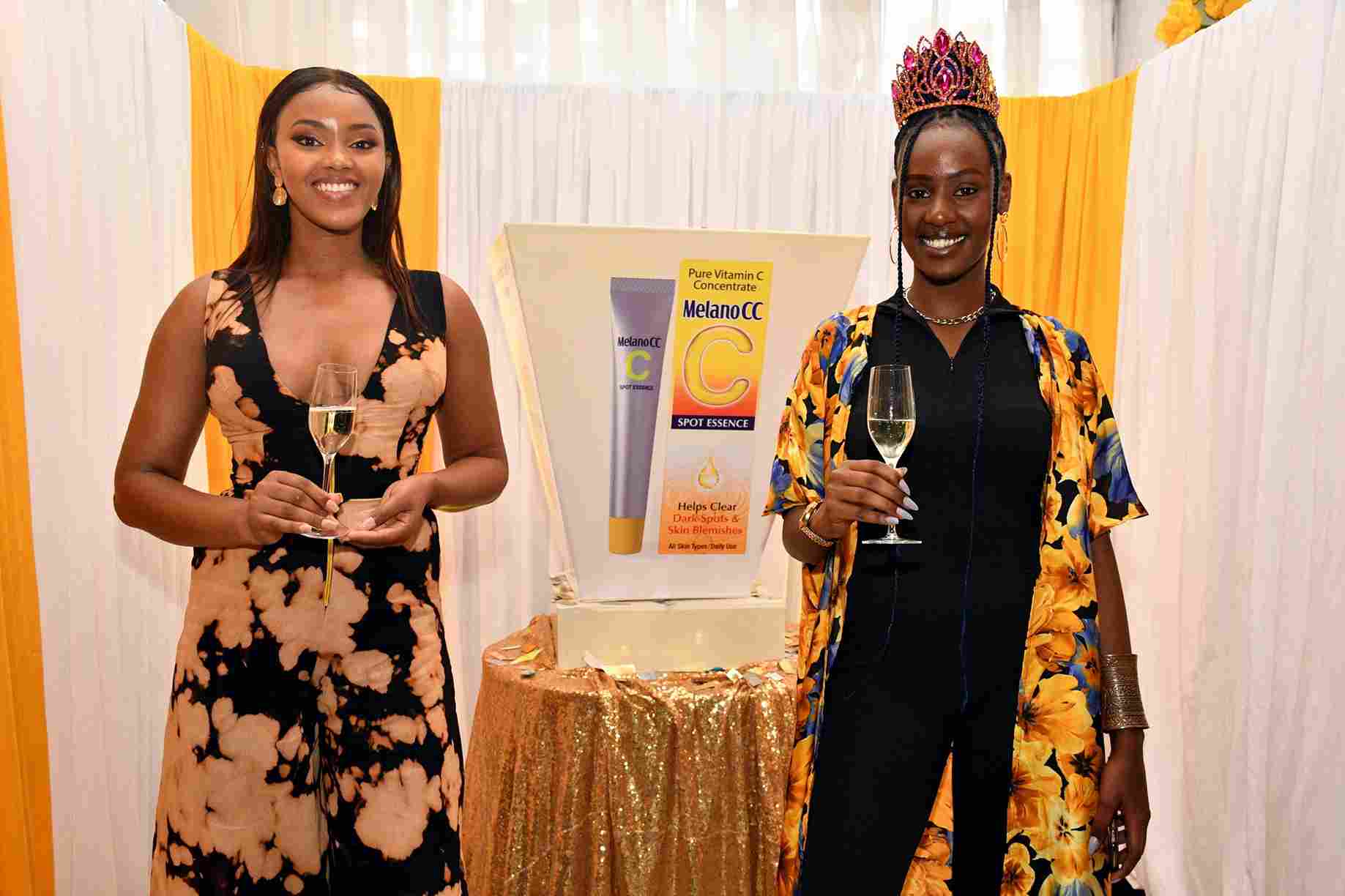 Miss Earth Kenya 2019 Susan Kirui (right) and Miss World Kenya 2019 Maria Wavinya pose for a picture during the launch of Melano CC beauty products at Skynest Slate Restaurant