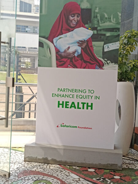 Safaricom Foundation billboard showing how they are investing in healthcare at the Safaricom Michael Joseph Center.