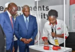 President William Ruto and Dr Mwangi at an Equity Agent booth during the launch of Gava Mkononi