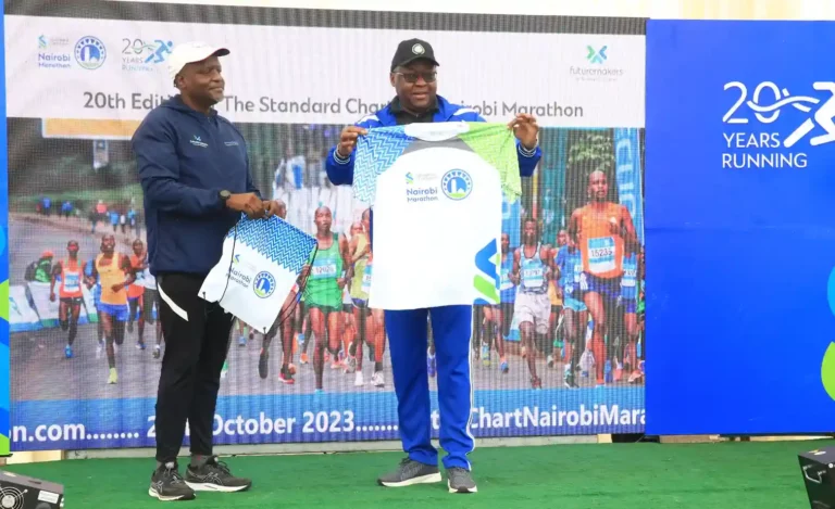 Standard Chartered Bank – Kenya, Chief Executive Officer - Kariuki Ngari and Nairobi Deputy Governor - James Njoroge Muchiri showcasing the new kit of the 20th edition of the Standard Chartered Nairobi Marathon 2023.