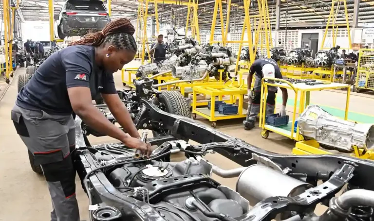 An Engineer assembling parts of a vehicle at the Toyota Fortuner Assembly Line, Miritini, Mombasa County.