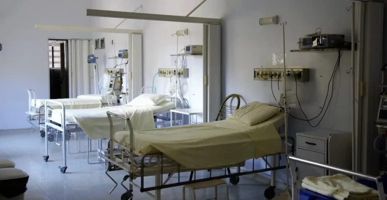 White Hospital Beds that are used by patients to recover from surgery.