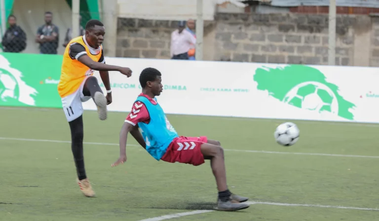 Former Chapa Dimba players battle it out in a gracing match during the launch of Safaricom Chapa Dimba Season 4 at Camp Toyoyo Grounds in Nairobi.