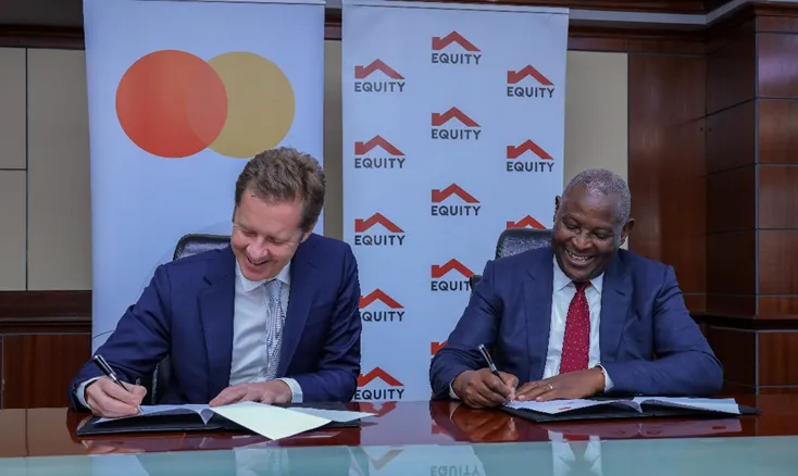 (L-R) Mark Elliott, Division President for Sub Saharan Africa at Mastercard and Dr. James Mwangi, Equity Group Managing Director and CEO, sign a 10-year partnership agreement that will deliver innovative solutions for various customer segments including e-commerce payments, cross border payments, community pass for farmers and small businesses, QR and tap on phone.