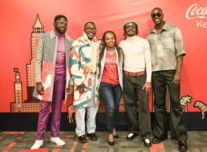 Polycarp, Chimano, Savara and Bien from Sauti Sol pose for a photo with Isabelle Rostom Kariuki, Coca Cola's Marketing Director, East and Central Africa at the Sol Fest partnership announcement between Coke Studio and Sauti Sol,