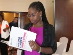 Julia Majale Tuko.co.ke reading the policy paper titled ‘Media Under Pressure: The Trouble with Press Freedom in Kenya’ by the Friedrich Naumann Foundation (FNF)