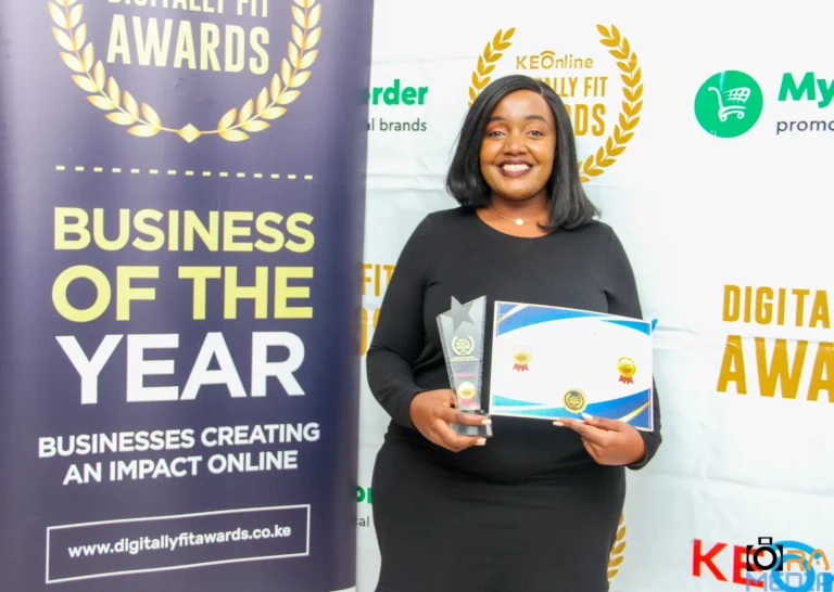 Ruby Orimba-Public Relations Manager, TUKO.co.ke holding the Digitally Fit News Agency and Service of 2023 awards.