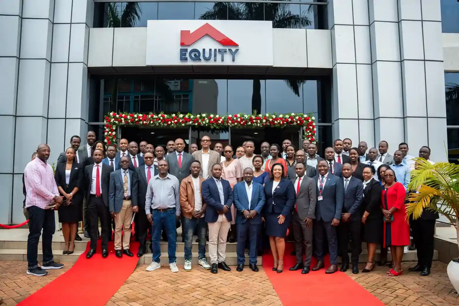 Equity Bank Rwanda Plc Managing Director, Hannington Namara (Left) and, Pharmaceutical and Medical Supplies Society Limited, Managing Director, Ernest Rwagasana (also a client) (Right) unveil the Equity Kigali Retail Branch (formerly Cogebanque) in Kigali, Rwanda.