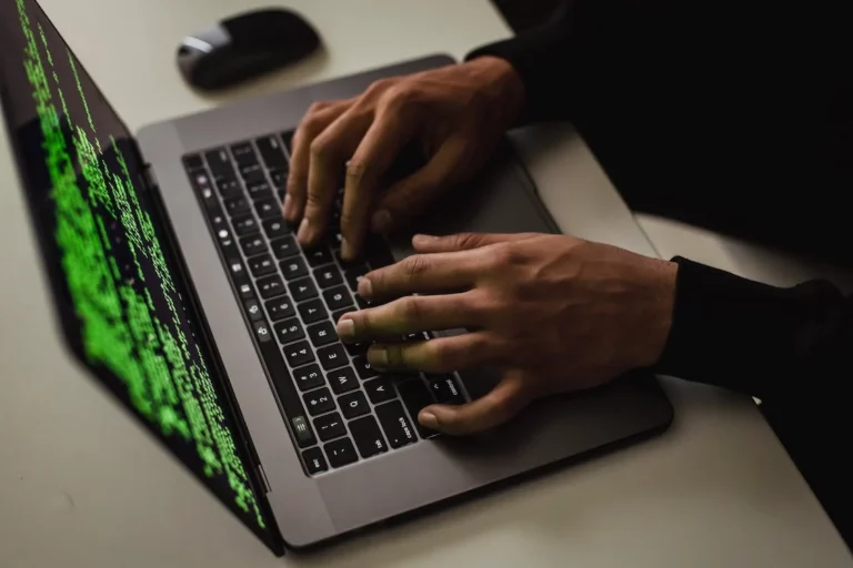 cyber spy hacking system while typing on laptop. Photo by Sora Shimazaki from Pexels: https://www.pexels.com/photo/crop-cyber-spy-hacking-system-while-typing-on-laptop-5935794/