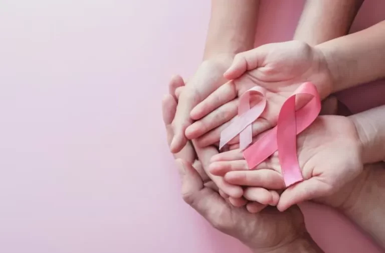 Photo hands holding pink ribbons on a pink background. Know Your Options: Understanding Cervical Cancer Prevention Tools