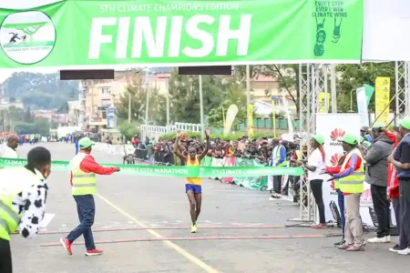 Emily Jepkemoi crosses the finish line to emerge the winner in the women's 42 km race category of the fifth edition of the Eldoret City Marathon held in Eldoret town, Uasin Gishu County.