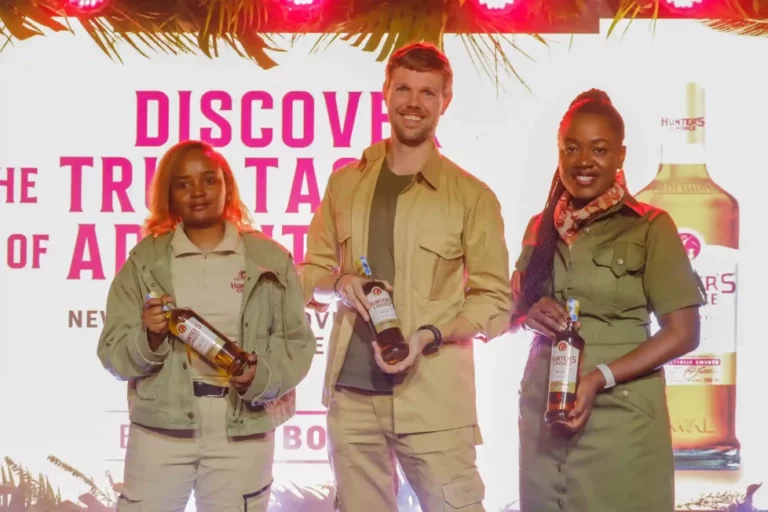 (From left to right) Lorraine Wairimu - Hunter’s Choice Brand Manager, Jonas Geeraerts, KWAL Commercial Director and Dr. Senorine Wasike - Head of Marketing KWAL pose for a photo with the newly branded bottle of Hunter’s choice during KWAL’s Hunter’s Choice rebrand at the Kenya Wildlife Service Club House.