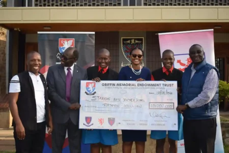 From Right The Griffin Memorial Endowment Trust (GMET) Trustees led by Chairman Noah Meely, Treasurer David Wachira and Secretary Vivian Onano present a cheque for KES 15M to Starehe Boys' Centre Director Mr. Fred Okono (far left)