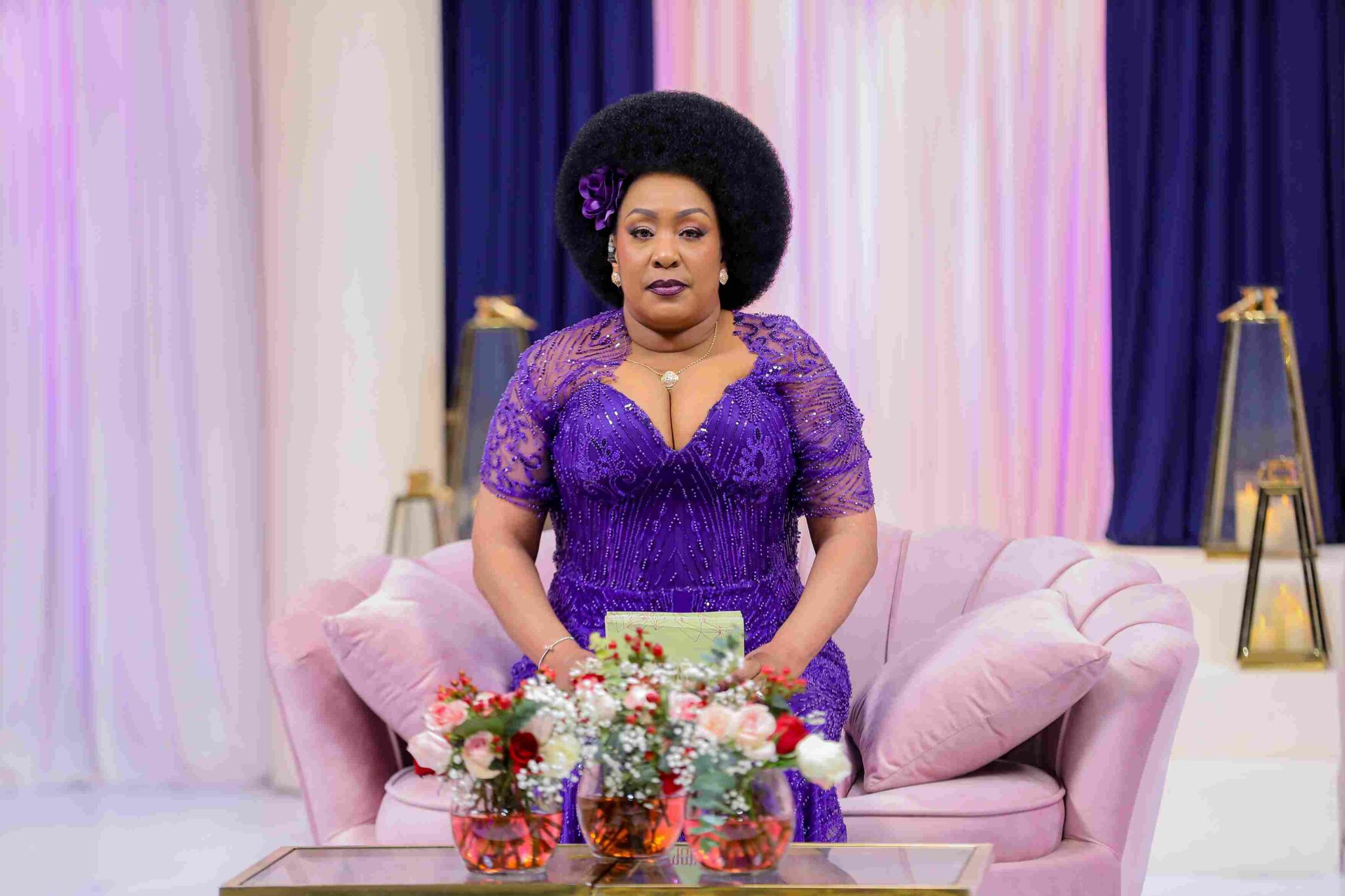 Veteran radio presenter Cess Mutungi sits center stage during The Mommy Club NBO reunion, engaging the cast with bold questions and signature charisma. Dressed in a chic ensemble, she leads the two-part special airing on 29 August and 5 September 2025, bringing her iconic voice and fearless energy to the screen.