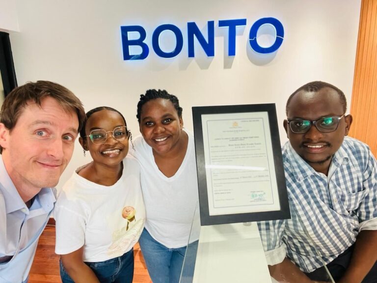Yoann Copreaux, founder of Bonto Kenya Money Transfer, and his team proudly display their Money Remittance Provider Licence certificate issued by the Central Bank of Kenya.
