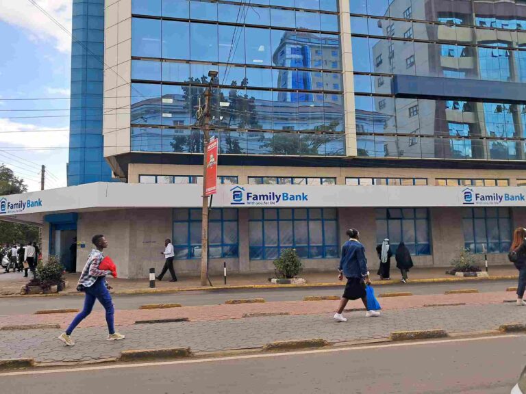 Street view of Family Bank branch in a modern commercial building with reflective glass windows.
