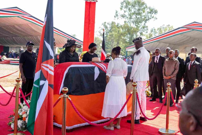 Odinga’s family stands in solemn tribute beside the late Raila Odinga’s casket.