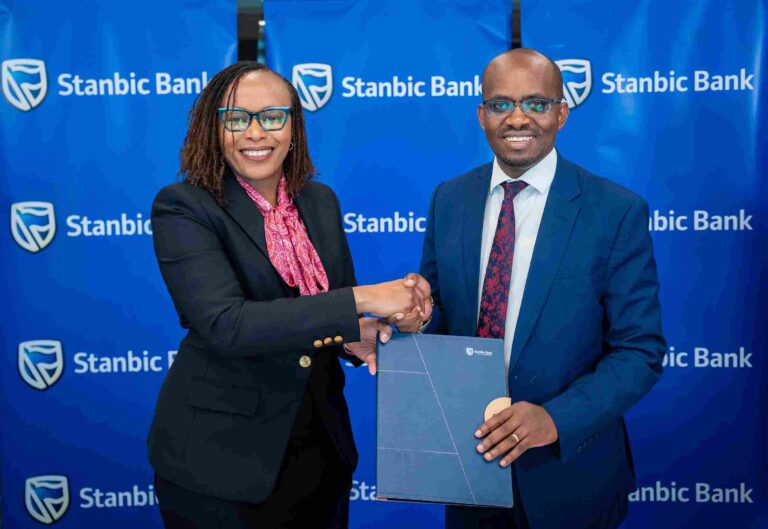 Stanbic Bank Kenya Scales Renewable Energy Financing to Advance ESG Goals Florence Wanja (left) of Stanbic Bank and Dalmus Mbai (right) of Safer Power during MoU signing ceremony.