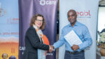 Arthur Mamvura of EABL Diageo Africa with Michelle Nunn of CARE International during MOU signing