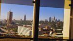 Nairobi skyline with KICC and modern skyscrapers viewed through glass windows