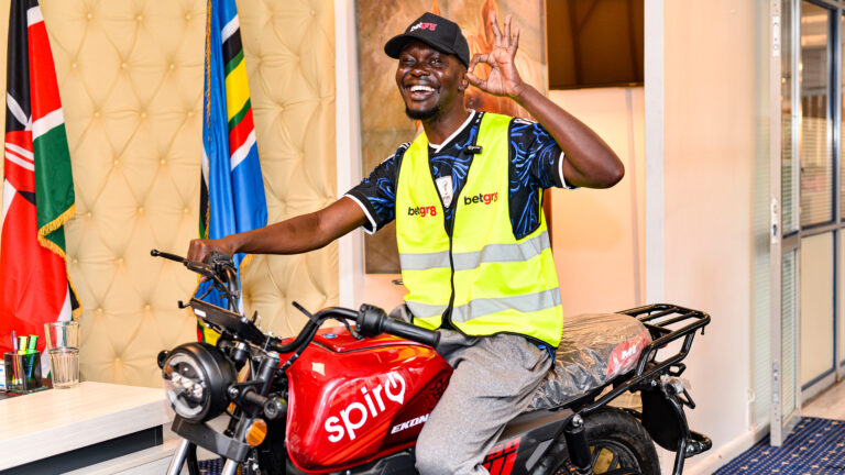 Football Skills Win Nairobi Entrepreneur a KSh 160,000 Spiro E-Bike at BetGr8 World Cup Party Clinton Odhiambo Odanga holds his Spiro electric bike prize at Uhuru Park after winning the BetGr8 Pepeta Challenge during the World Cup Kick-Off Watch Party in Nairobi.