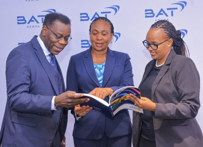 BAT Kenya Chairperson Rita Kavashe, Managing Director Crispin Achola and Finance Director Catherine Chepkong'a reviewing the 2025 Combined Financial and Sustainability Report at the company's 74th Annual General Meeting