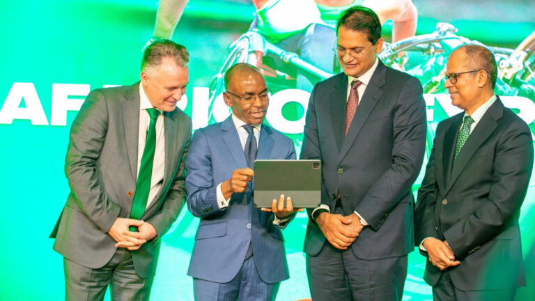 Safaricom Foundations Invest Billions As Climate Goals Lag Wim Vanhelleputte, Peter Ndegwa, Adil Khawaja and Dilip Pal viewing tablet