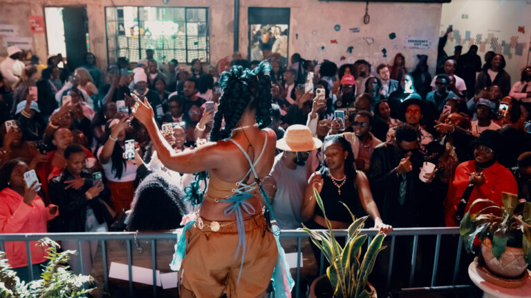 Greasy Tunes Turns Nairobi’s Gen Z Streaming Boom Into a Physical Stage Crowd filming a live performance at Assembly Lite during Greasy Tunes Nairobi
