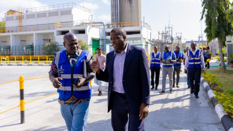 Bamburi Cement And KPLC Deepen Coast Power Partnership KPLC and Bamburi Cement officials walking through the Mombasa Plant grounds during a site visit, with plant infrastructure and a power substation in the background.